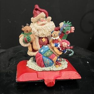 Cast iron Festive Santa Figurine with Toys stocking hanger